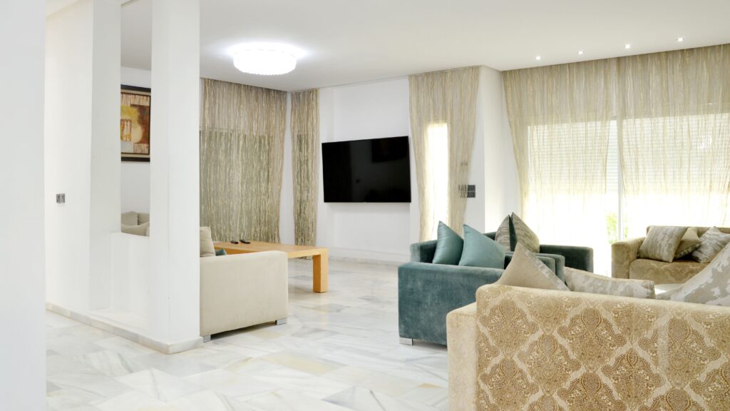 Spacious modern living room with elegant sofas and stylish decor.