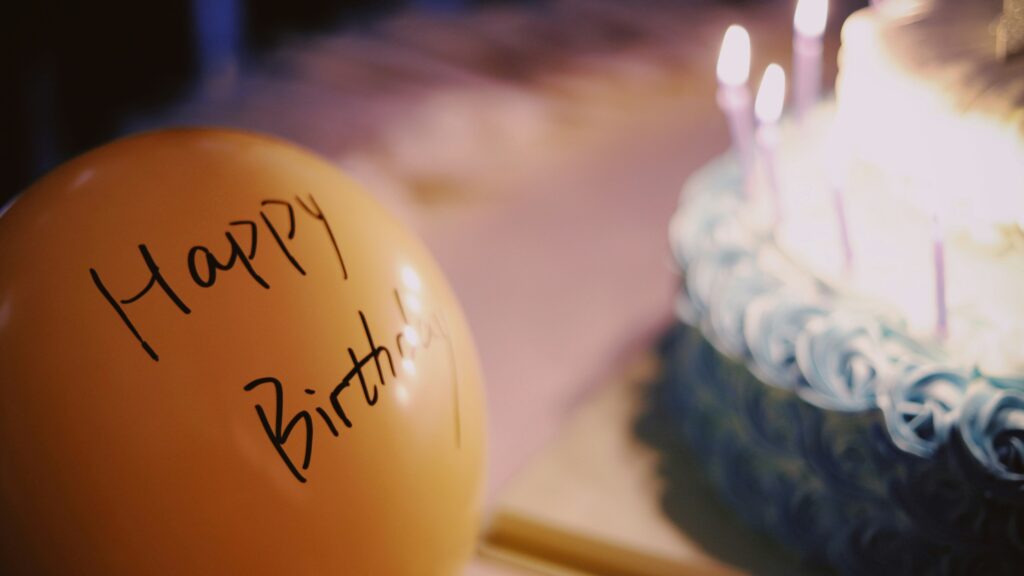 yellow balloon near cake