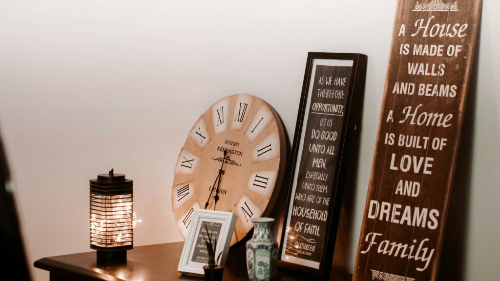 a table with a clock and a couple of signs