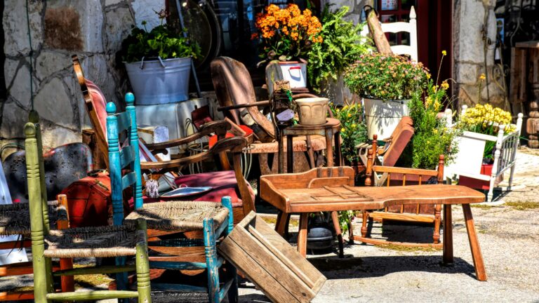 a number of chairs and tables outside of a building