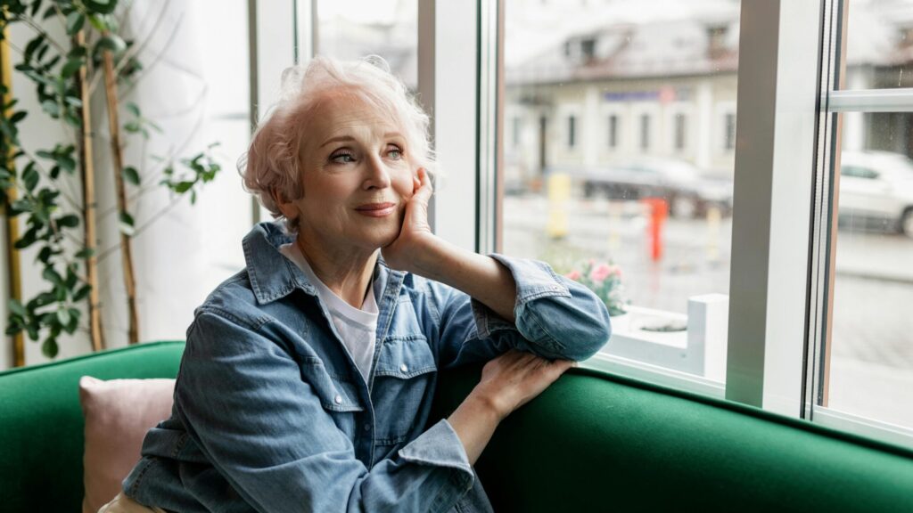 woman relaxing looking out window