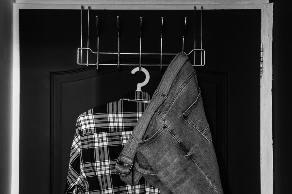 narrow clothes rack on back of door
