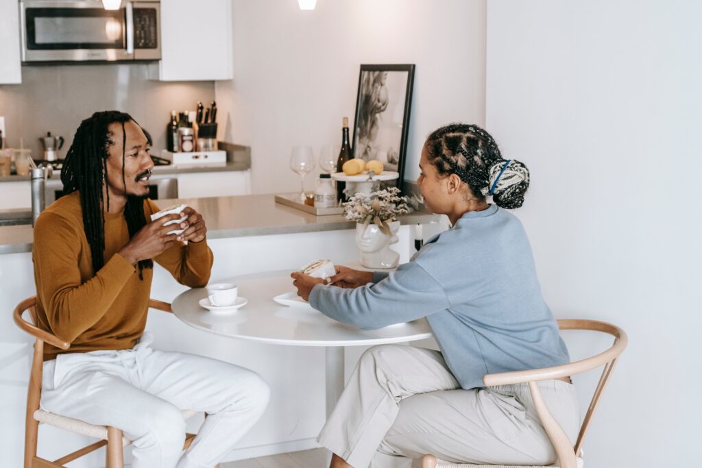 couple talking sitting at kitchen table