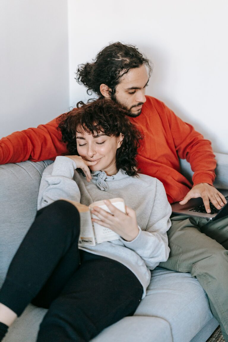 couple relaxed sitting on couch