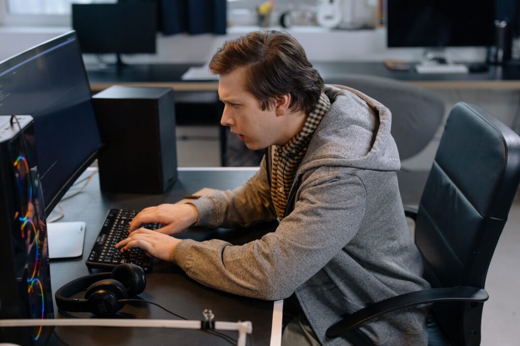man with bad posture working on computer