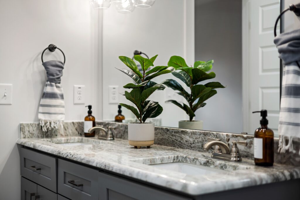 clean bathroom with hand soap, towels