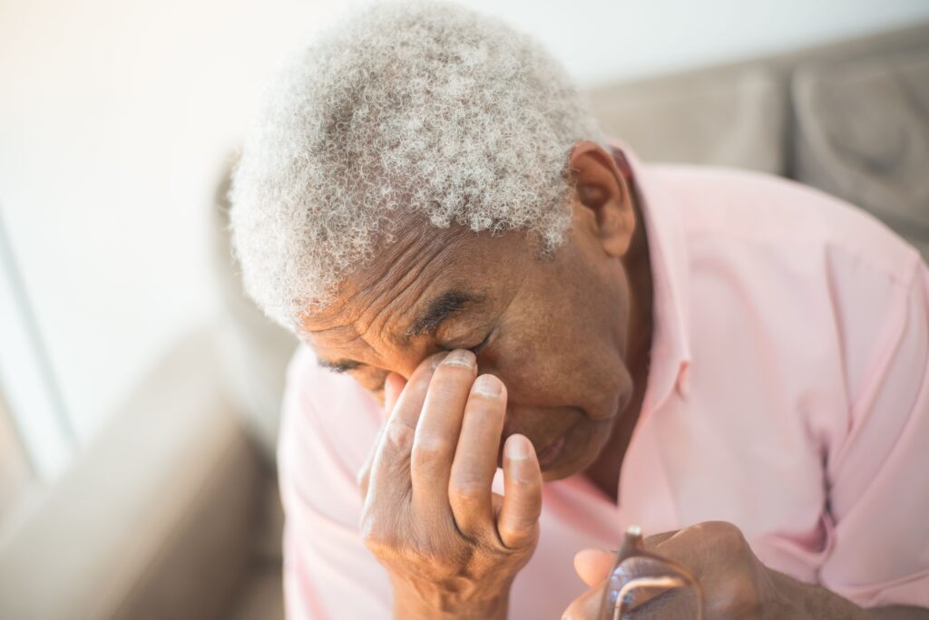 older person feeling tired