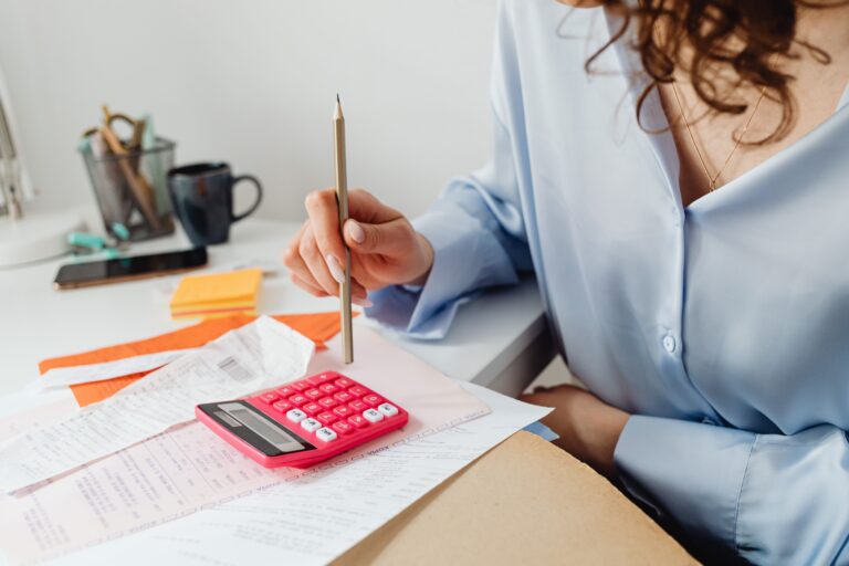 woman calculating monthly payments