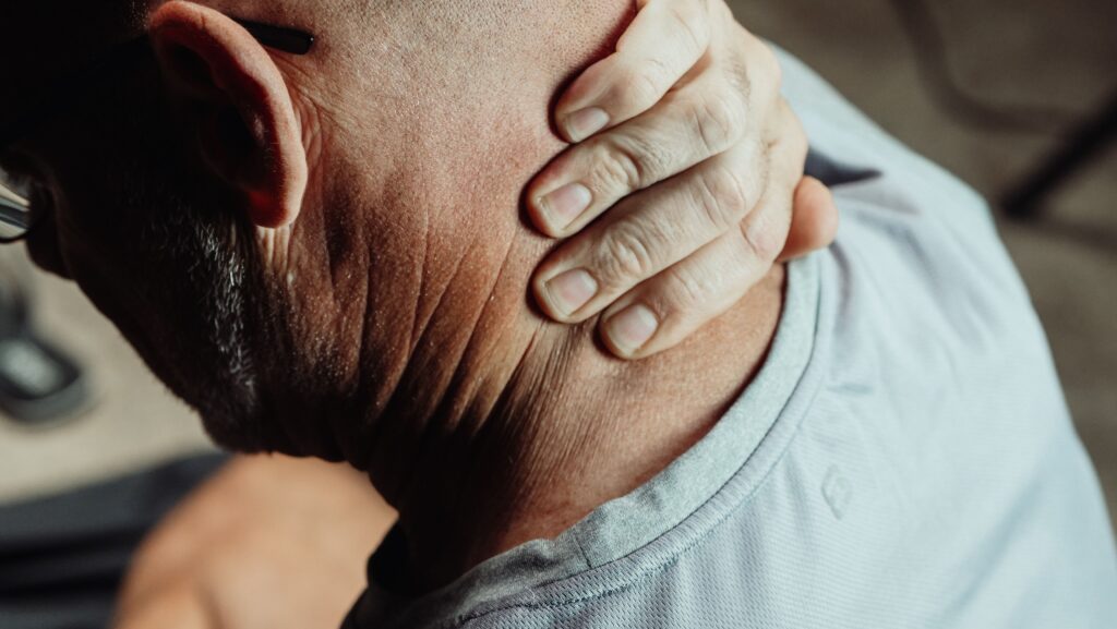 senior person waking up with morning stiffness