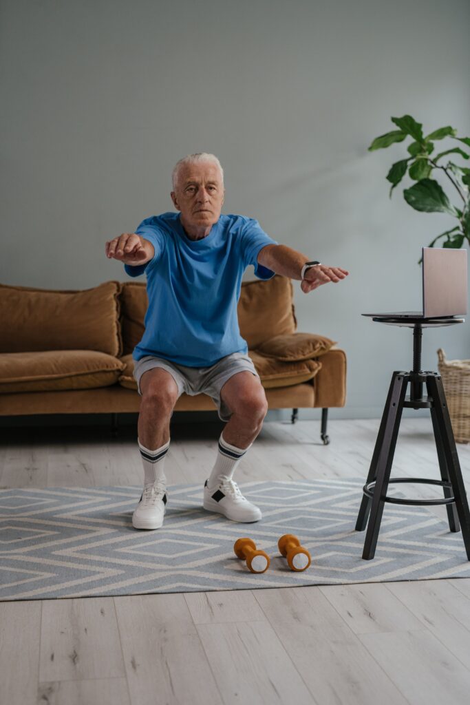 senior man performing squats
