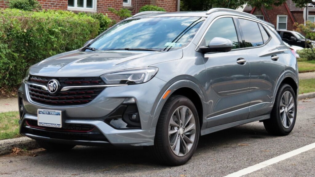A gray 2020 Buick Encore GX SUV parked on a residential street, one of the models included in the rearview camera recall