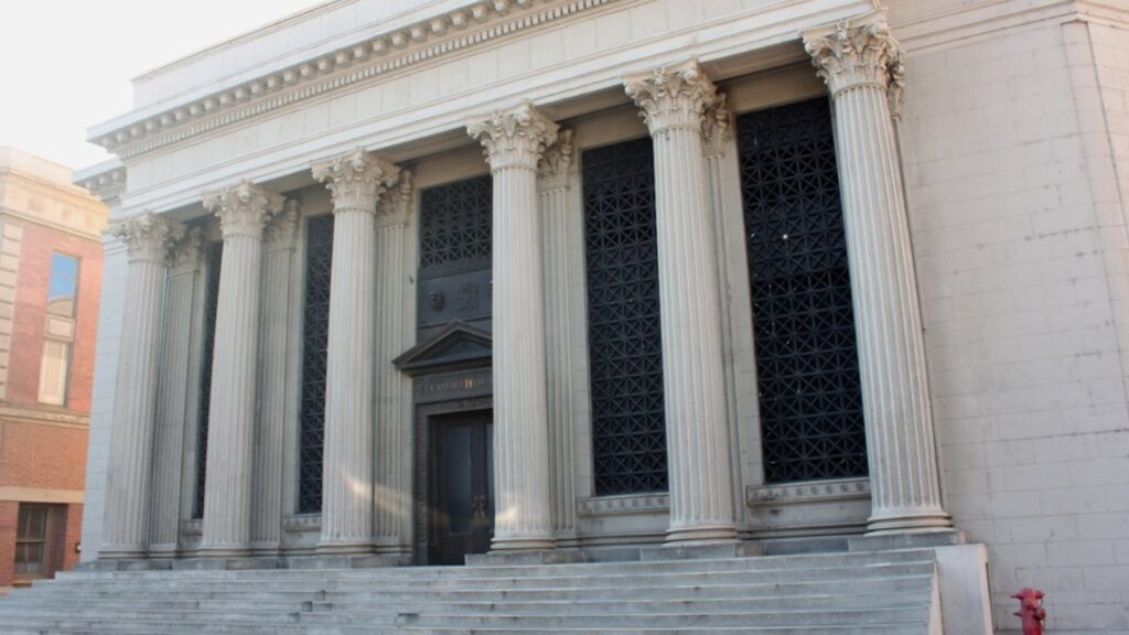 The columned facade of a courthouse building