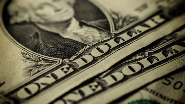 Close-up of folded US one dollar bills