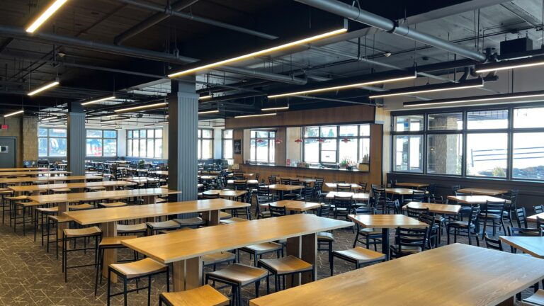 a large room with tables and chairs in it