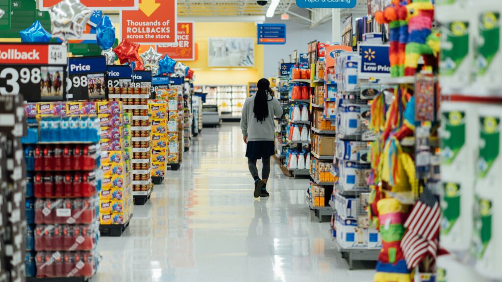 person standing between shelvings