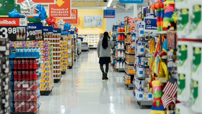 person standing between shelvings