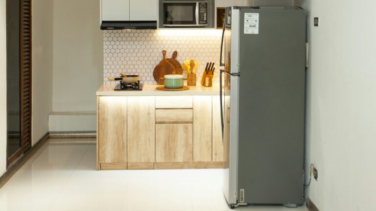a kitchen with a refrigerator freezer sitting next to a stove top oven