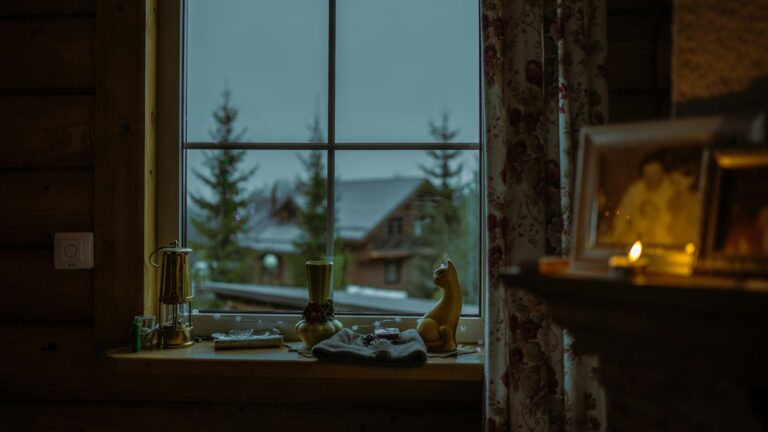 a window with a view of a snowy mountain