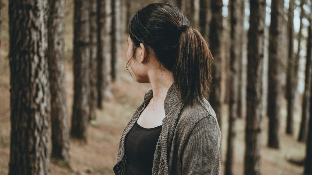 selective focus photography of woman looking back