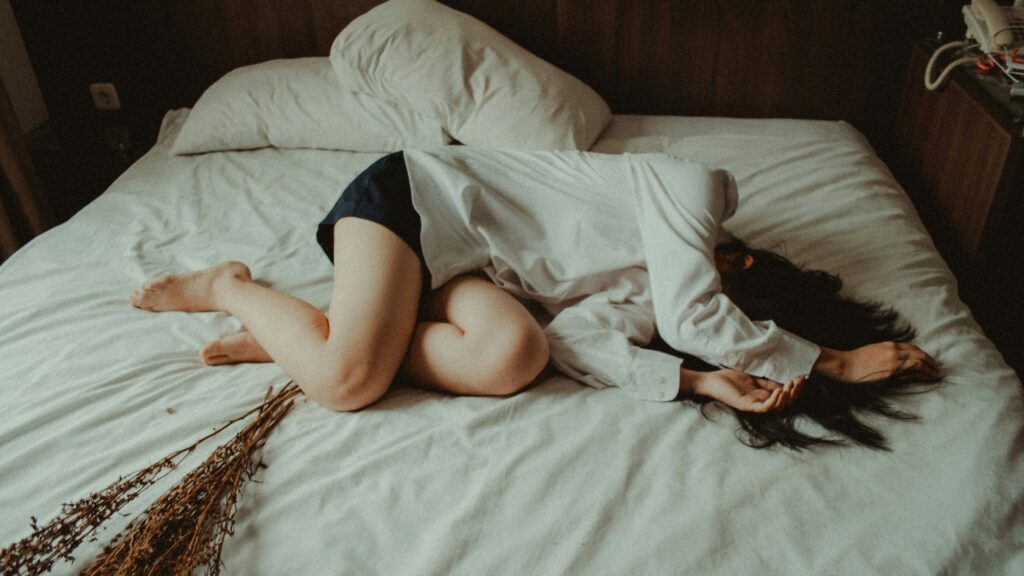 woman lying on bed