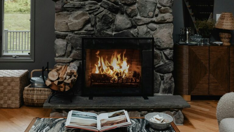 a living room filled with furniture and a fire place