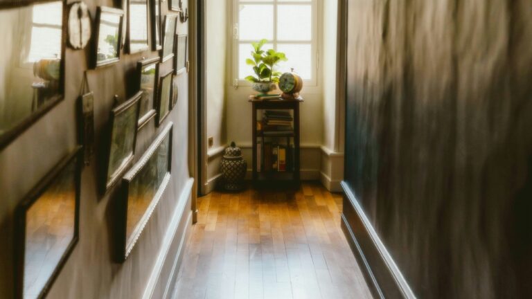 A long hallway with pictures on the wall