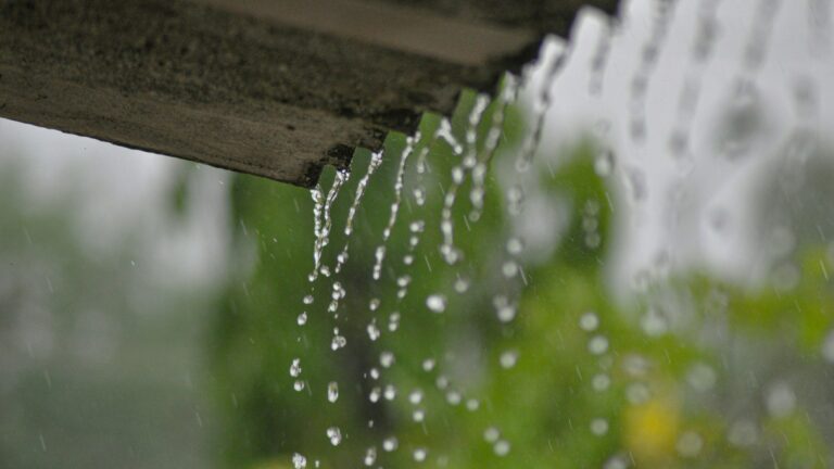 a rain gutter with water running down it