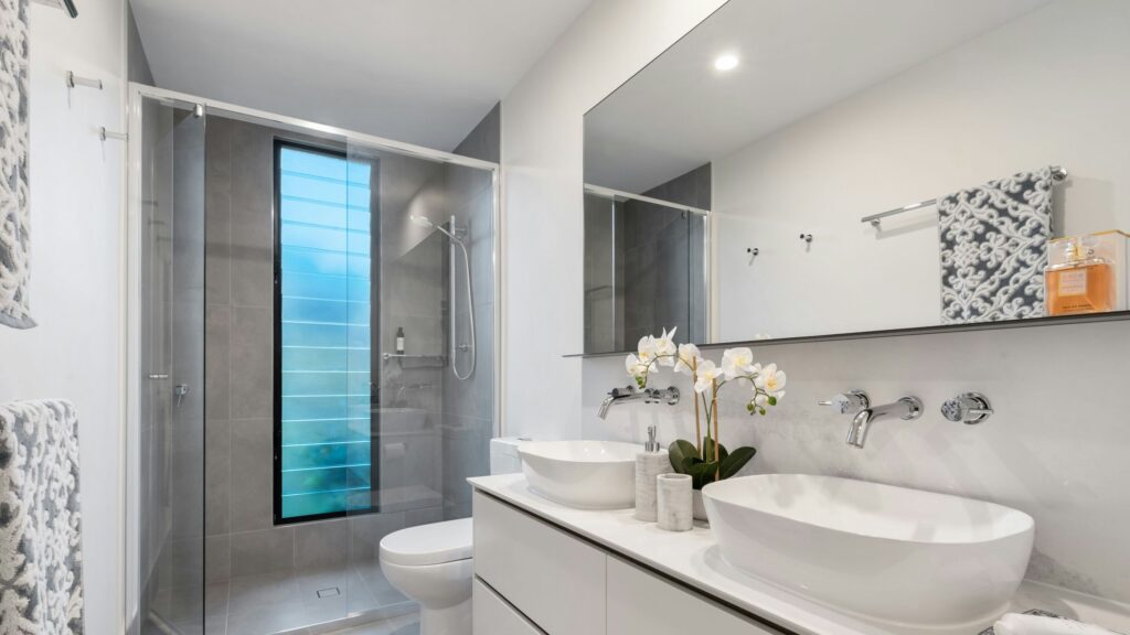 white ceramic sink with mirror