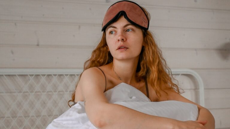 a woman lying on a bed