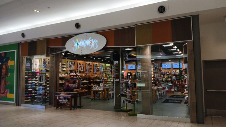 The storefront of a Journeys shoe store inside a shopping mall