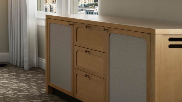 Close-up of a wooden bedroom dresser with drawers