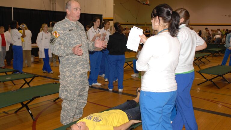 A National Guard servicemember in uniform at a civilian medical training exercise, generic stand-in for a USERRA employment-rights case