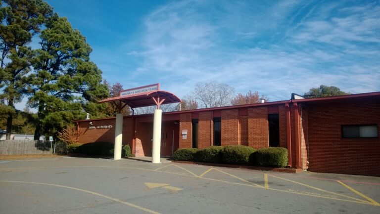 Brick exterior and front entrance of a neighborhood elementary school