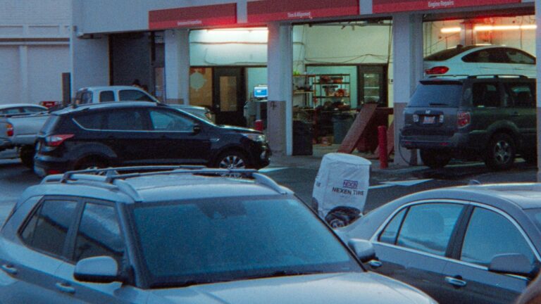Cars parked in a lot outside a service center