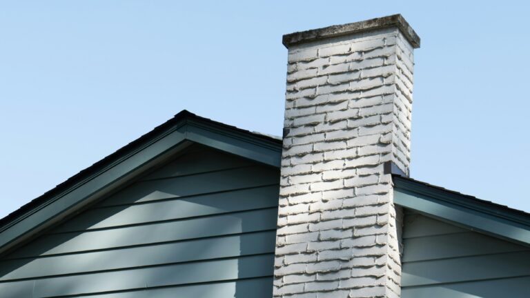 gray brick wall under blue sky during daytime