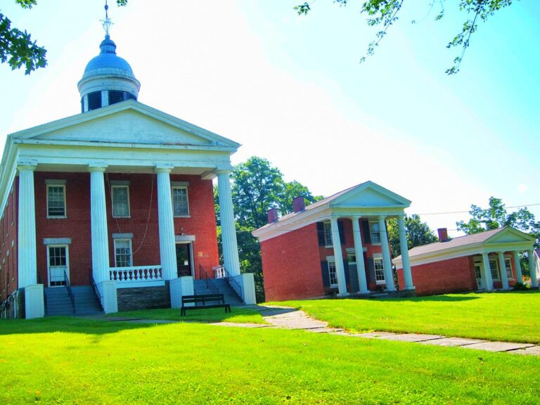 A historic red-brick courthouse building with white columns