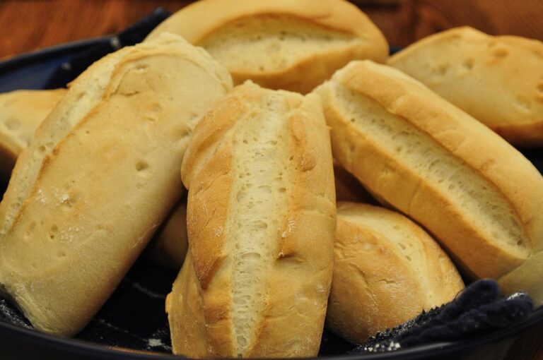 A plate of fresh hoagie-style bread rolls