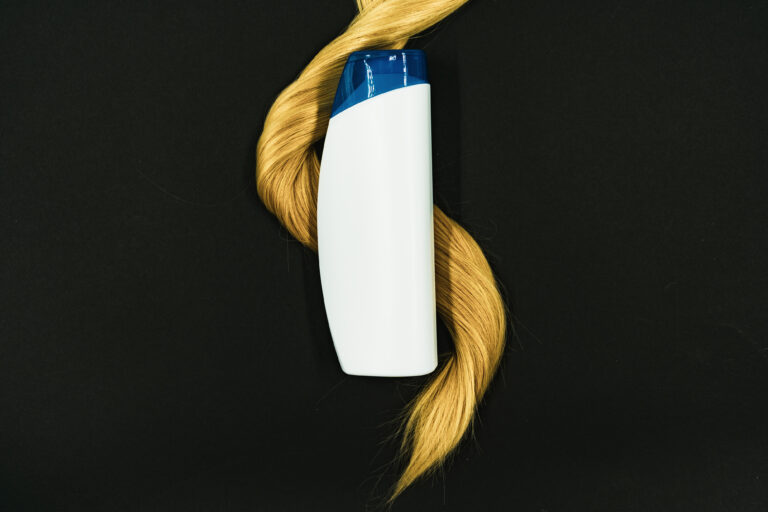 An unbranded hair-treatment product bottle