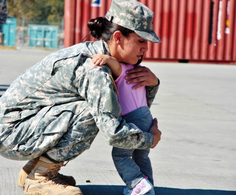 A parent warmly embracing their young daughter