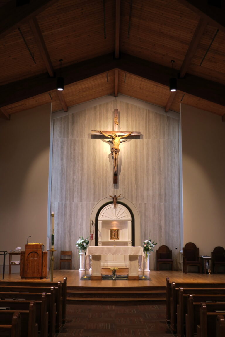 A Catholic church sanctuary with altar and crucifix, representing the diocese setting of the story