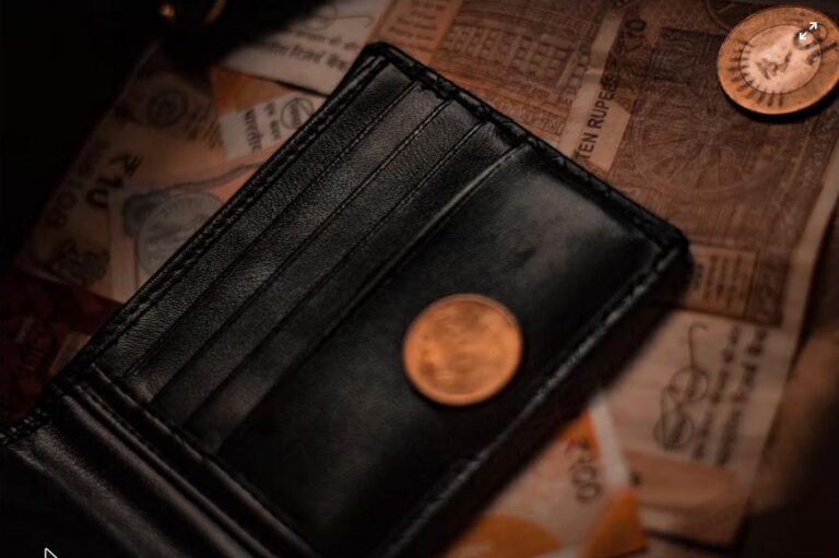Small wallet with coins on top
