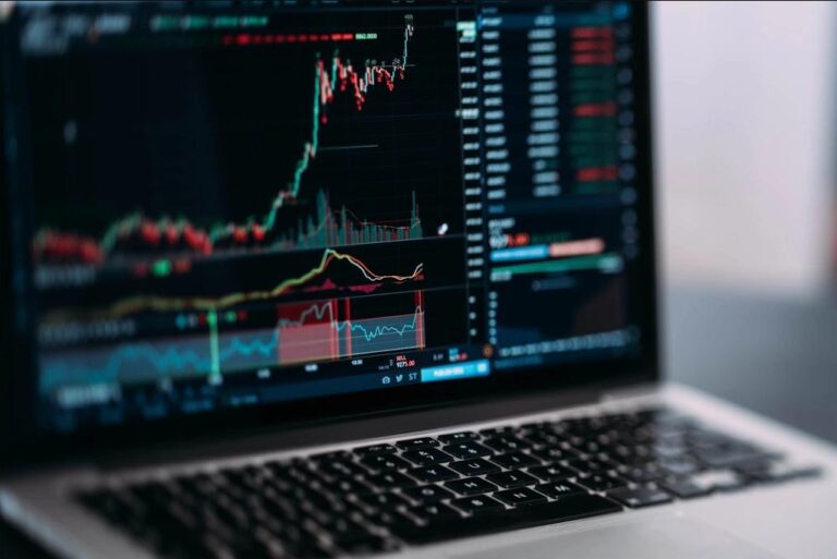 A laptop screen showing a stock trading chart