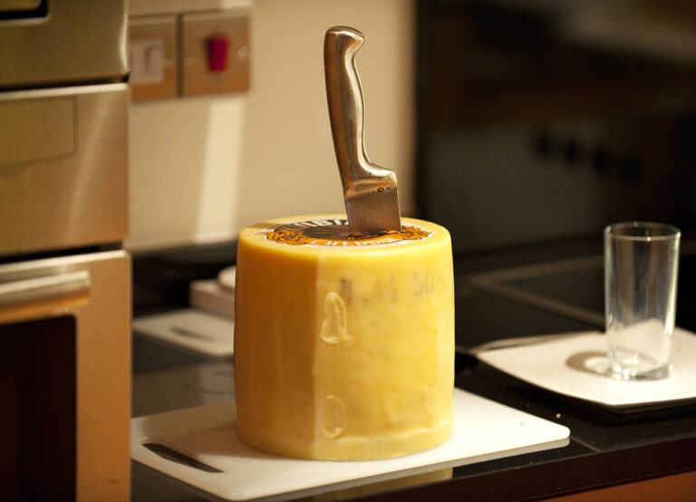 raw cheddar cheese wheel